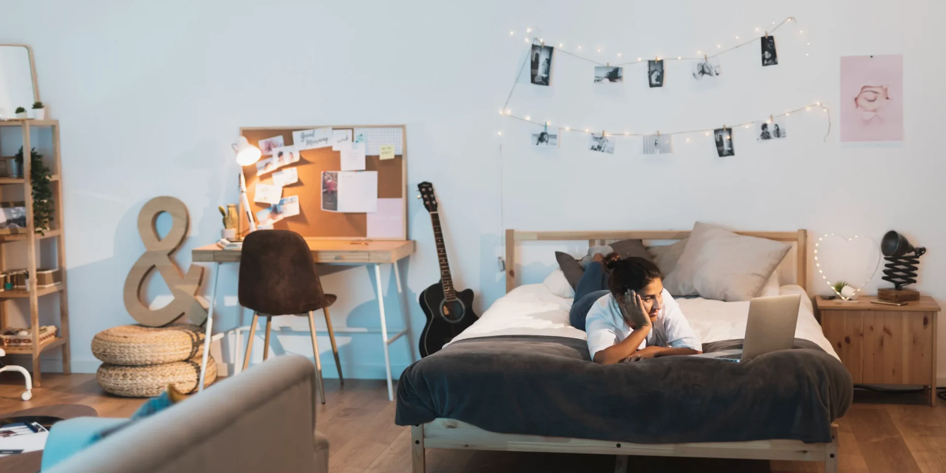 woman staying bed looking laptop scaled